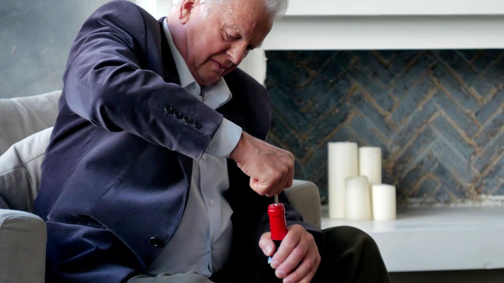 elderly-man-try-open-bottle-wine-home_867394-1016.jpg